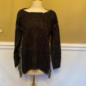 Speckled black and white sweater w/ fringed sides.